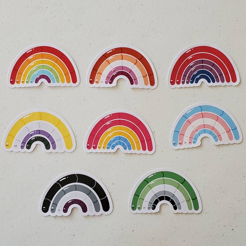May include: Set of ten rainbow-coloured vinyl stickers featuring a rainbow design with worm-like shapes. Each sticker is approximately 6.5 cm wide.