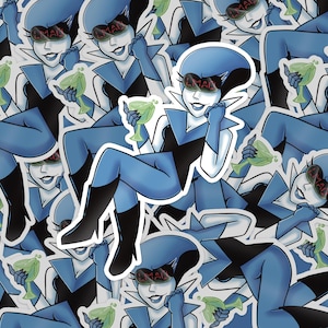 May include: A sticker sheet featuring a cartoon character in a blue and black outfit, wearing sunglasses with the word "MAI" on them. The character is holding a green cocktail. The background is filled with the same character.