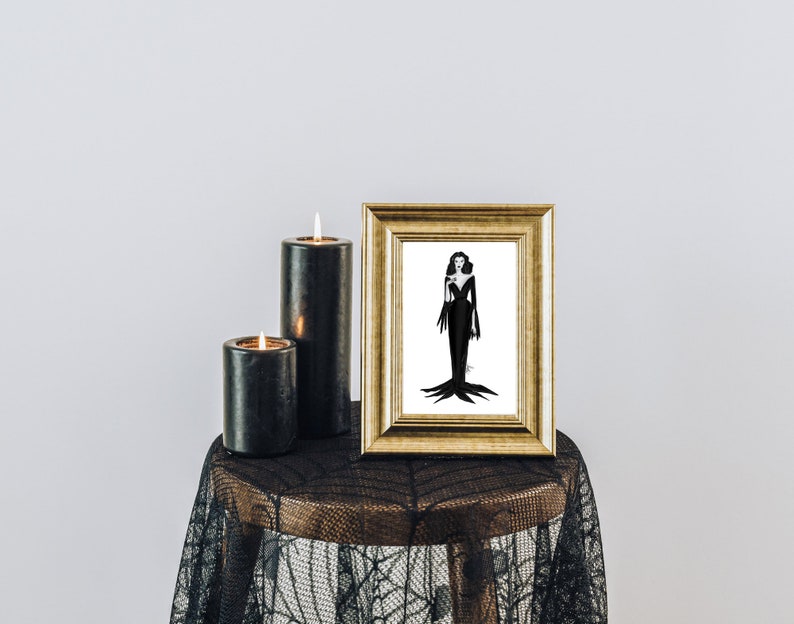 May include: A gold-framed illustration of a woman in a black dress, displayed on a small table. Two black candles with lit flames are next to the frame. The table is covered with a black lace cloth.
