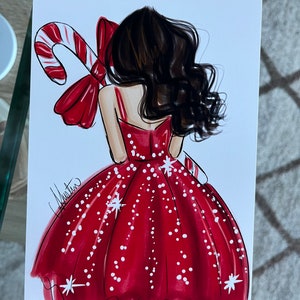 Op de afbeelding: Illustratie van een vrouw in een rode jurk met witte stippen en een zuurstok. De vrouw heeft donker haar en houdt een zuurstok met een rode strik vast. Het kunstwerk is gesigneerd door de kunstenaar.