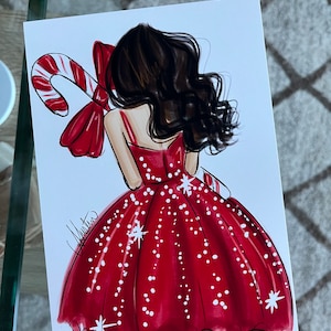Op de afbeelding: Illustratie van een vrouw in een rode jurk met witte stippen en steraccenten, die een zuurstok vasthoudt. Het kunstwerk toont donker haar en een grote rode strik. De handtekening van de kunstenaar is zichtbaar.