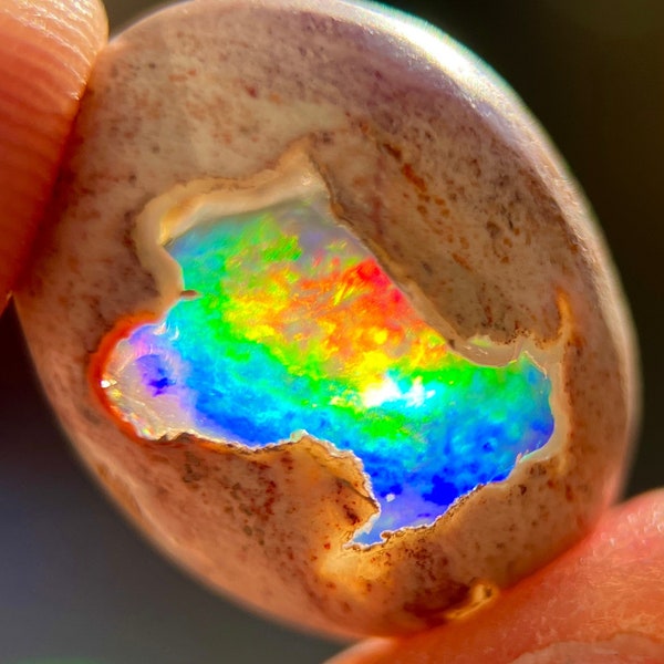 Full Spectrum, The Rarest Color Ever Found, Cantera Opal, AAA Grade Quality Collection, 19x15x8 mm 11.37 carats. Against Light.