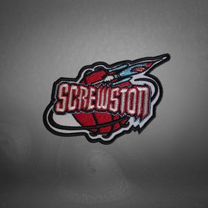 May include: Embroidered patch featuring the word "SCREWSTON" in red and white, arched over a red basketball. A blue and white rocket design is above the ball, all outlined in black.