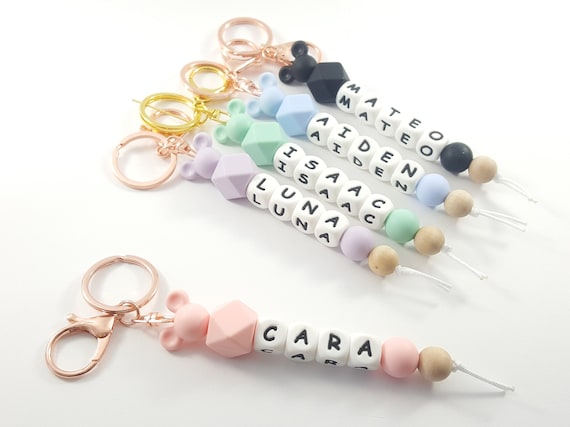 Disney family Personalized silicone beaded keychains. Diaper bag accessory baby shower gift. Features mouse ears in choice of color Disney family Personalized silicone beaded keychains. Diaper bag accessory baby shower gift. Features mouse ears in choice of color