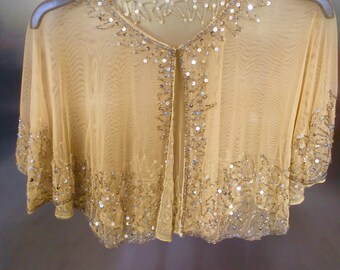 Beige coloured beaded embellished cape