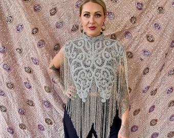 Silver beaded cape with long bead strand fringe