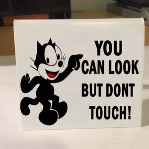 Carl&#39;s Jr Felix Chevrolet Look But Dont Touch - 3 Colors -Classic Dash Table Number with Felix the Cat, look but do not touch, impala, chevy