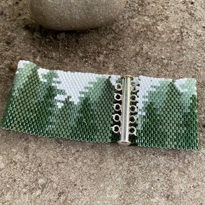 Cuff bracelet using 11/0 Delica beads and peyote stitch. Lovely scene of conifer forrest. Pattern purchased from BeadingWithBugs. image 5