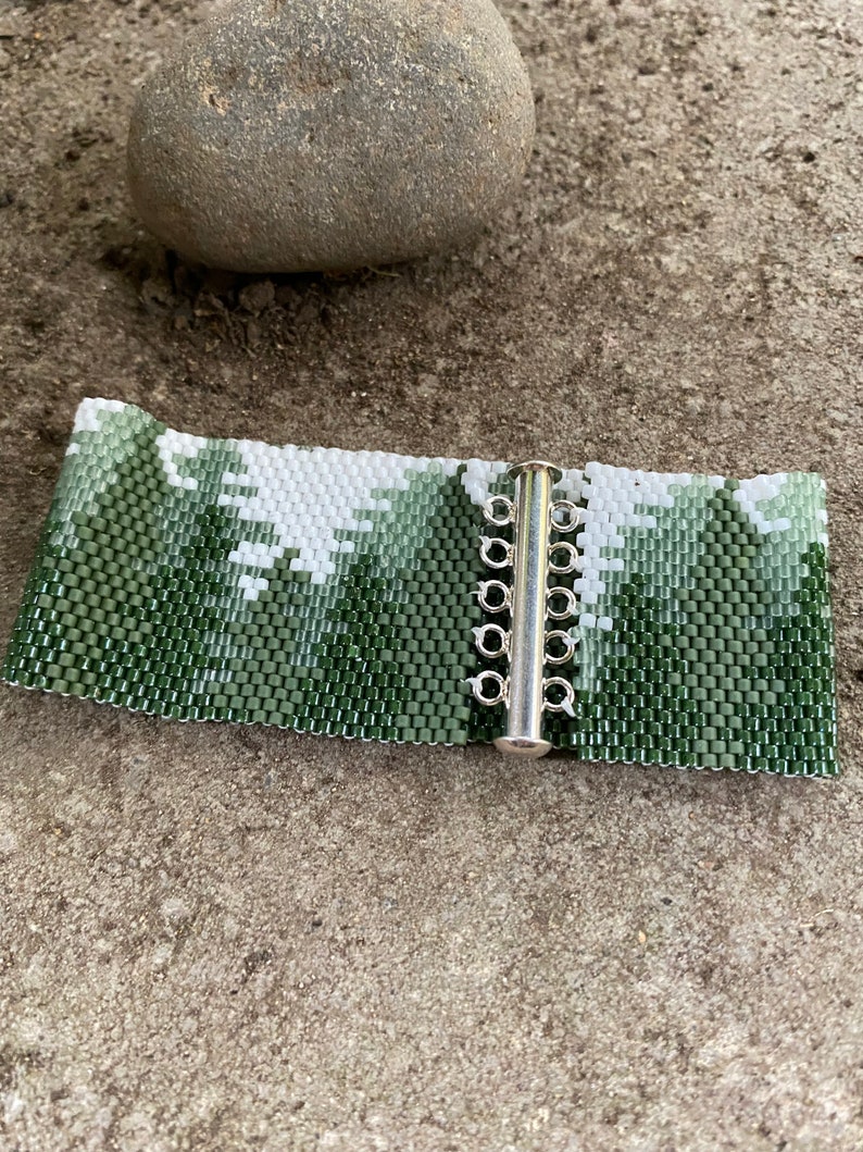 Cuff bracelet using 11/0 Delica beads and peyote stitch. Lovely scene of conifer forrest. Pattern purchased from BeadingWithBugs. image 5