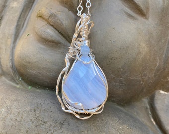 Faceted blue lace agate pendant wire wrapped with sterling silver (Argentium) wires. Free silver plated chain included.