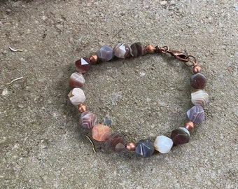 Faceted Botswana agate bracelet with copper accents. Lobster claw clasp