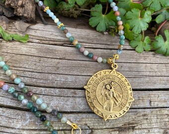 St. Christopher medallion hung from a strand of small, faceted Indian agate beads with gold accents.