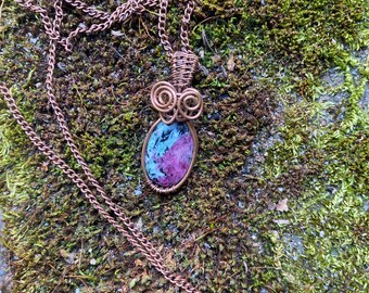 Ruby in Zoisite pendant wire wrapped/weaved with copper wires and hung from a copper plated chain.