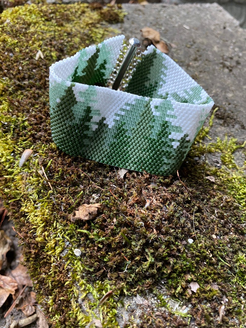 Cuff bracelet using 11/0 Delica beads and peyote stitch. Lovely scene of conifer forrest. Pattern purchased from BeadingWithBugs. image 2