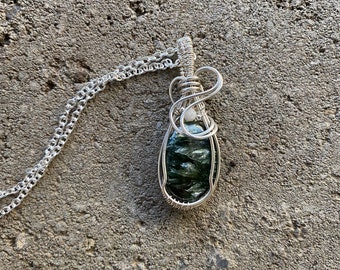 Seraphinite pendant with tiny moonstone accent wire wrapped with Argentium silver wires. Free silver plated chain included.