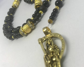 Black and golden Holy Death's rosary