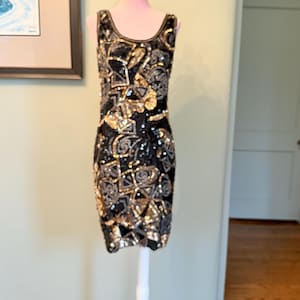 white and gold dress original image Infinity Dress in Mini Fleck Sequin Black and Gold – motelrocks-com-us main image 0