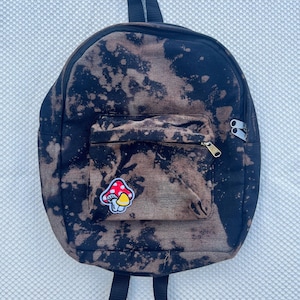 miniryggsäck med omvänd rågfärg och svamplapp