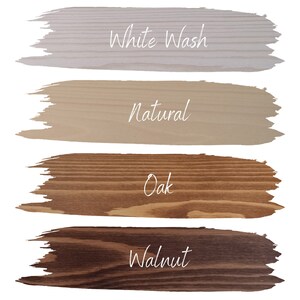 May include: Four wood stain samples: White Wash, Natural, Oak, and Walnut. Each sample is a brushstroke shape with the stain color and name in white script. The wood grain is visible in the Oak and Walnut samples.