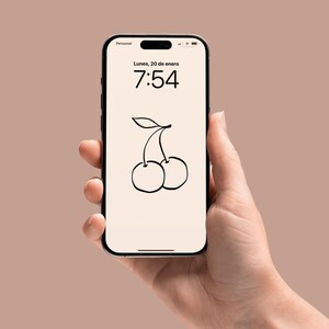 May include: A smartphone displaying a digital clock with the time 7:54 and the date Lunes, 20 de enero. The background of the phone screen is white with a black line drawing of two cherries.