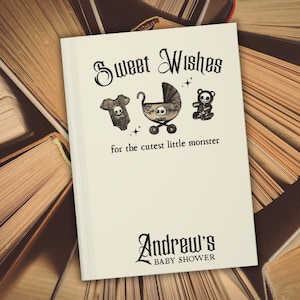 May include: A white baby shower card with the text "Sweet Wishes" and "for the cutest little monster." The card features illustrations of a onesie, stroller, and teddy bear, each with a skull design. The card is personalized with the name "Andrew's" and "BABY SHOWER."
