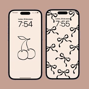 May include: Two iPhone lock screens, one with a black and white cherry illustration and the time 7:54, the other with a black and white bow pattern and the time 7:55.