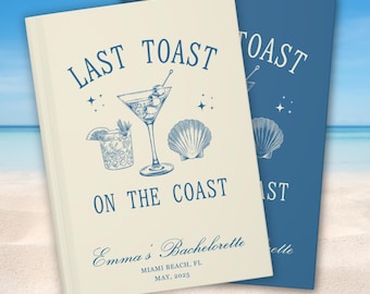 May include: A white and blue book with the text "Last Toast on the Coast" and a cocktail glass and seashell illustration. The book also includes the text "Emma's Bachelorette, Miami Beach, FL, May, 2025".