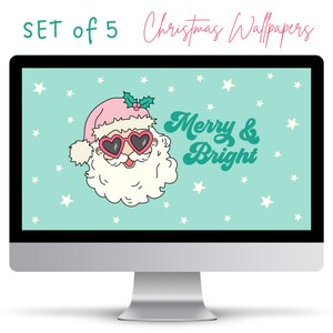 May include: A computer screen displaying a Christmas themed wallpaper with a cartoon Santa Claus wearing pink heart-shaped sunglasses and a pink hat with a green holly sprig. The background is teal blue with white stars and the text "Merry & Bright" in a retro font.