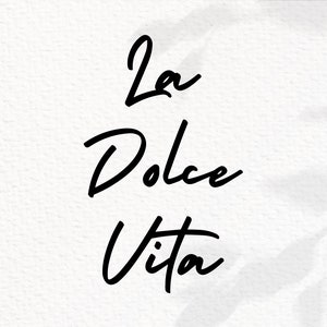 May include: Black and white handwritten text on a white background that reads "La Dolce Vita".