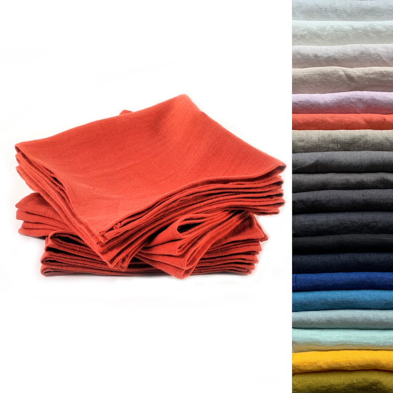 May include: A stack of 10 red linen napkins, folded in half. The napkins are made of 100% linen and are perfect for everyday use.