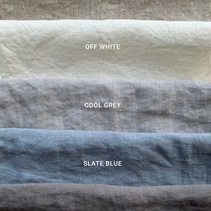 May include: Five fabric swatches in different colors: natural, off white, cool grey, slate blue, and graphite.