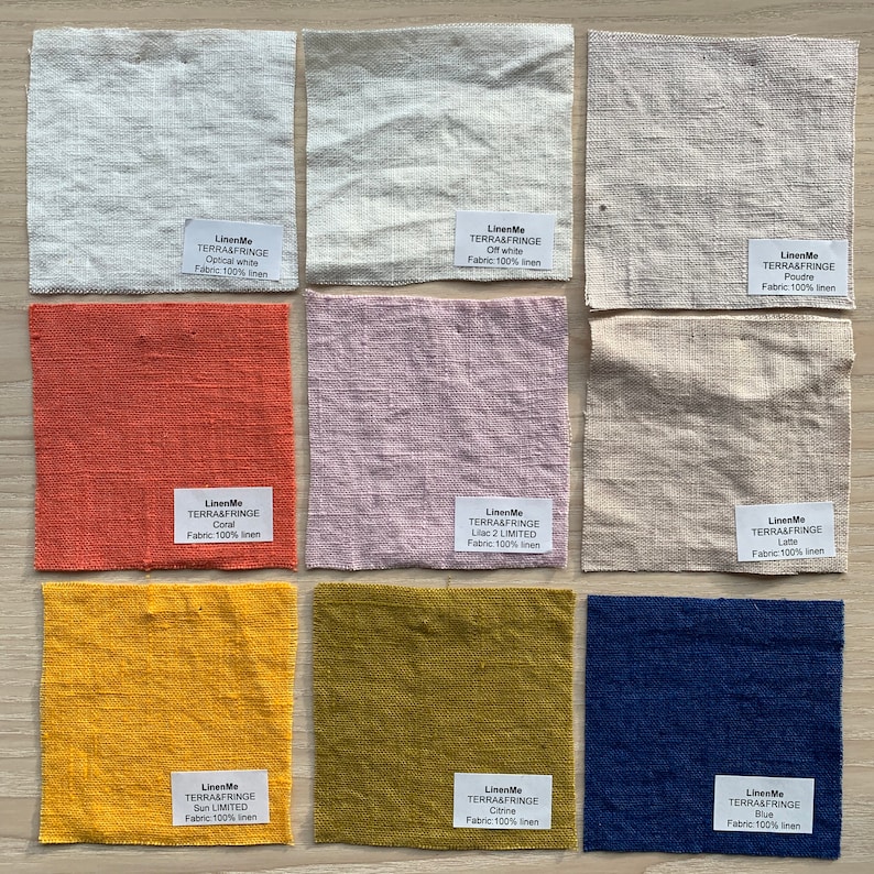 May include: Nine fabric swatches in various colors, including white, off-white, coral, lilac, latte, yellow, green, and blue. Each swatch has a label with the brand name "LinenMe" and the fabric type "TERRA&FRINGE".