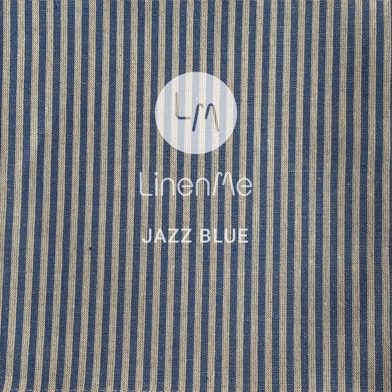 May include: Blue and white striped fabric with the text "LinenMe" and "Jazz Blue" printed on it.