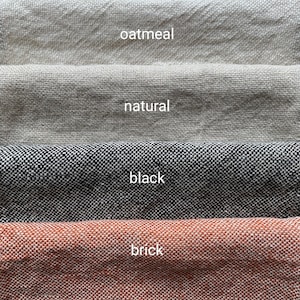 May include: Four fabric swatches in different colors: oatmeal, natural, black, and brick.