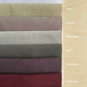 May include: A set of fabric swatches in various colors, including optical white, latte, mauve, steel grey, grey, aubergine, burgundy, and brown.