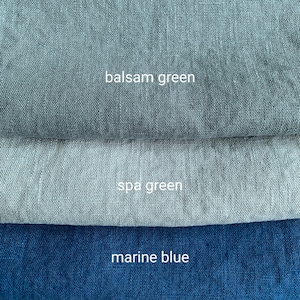 May include: Three fabric swatches in different shades of blue and green. The top swatch is a dark green called "balsam green", the middle swatch is a lighter green called "spa green", and the bottom swatch is a dark blue called "marine blue".