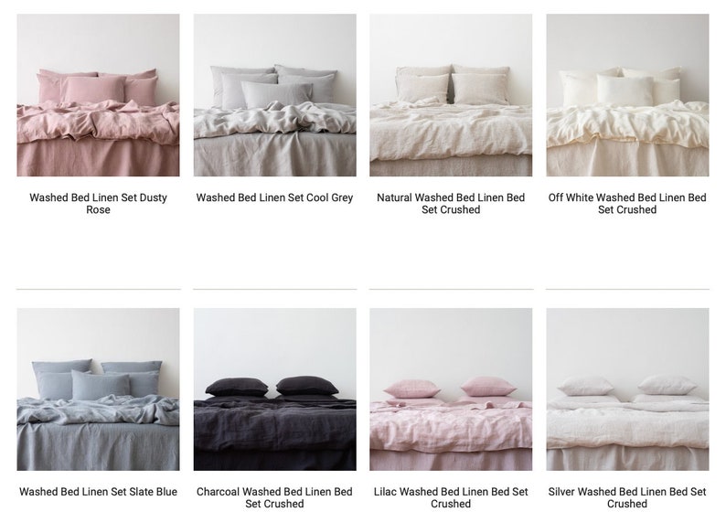 May include: A collection of eight linen bed sets in various colors, including dusty rose, cool grey, natural, off white, slate blue, charcoal, lilac, and silver. Each set features a duvet cover, pillowcases, and a flat sheet. The linen is washed and has a slightly wrinkled, or "crushed", texture.