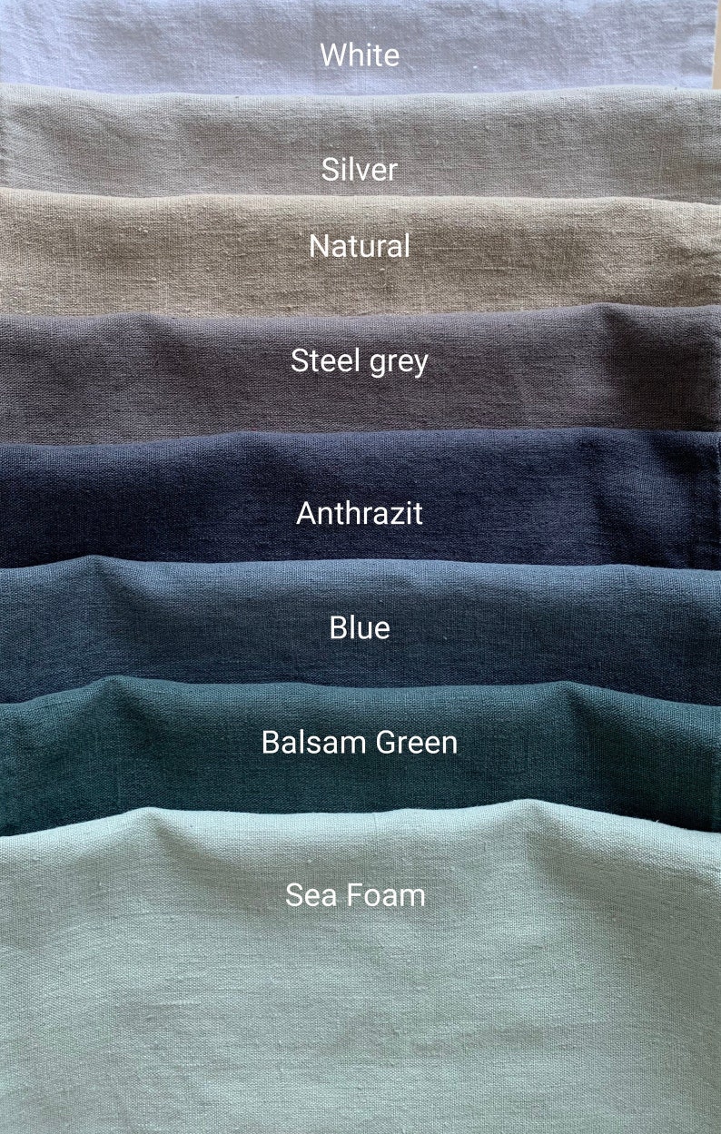 May include: A collection of eight fabric swatches in various colors, including white, silver, natural, steel grey, anthrazit, blue, balsam green, and sea foam.