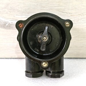 May include: A black bakelite electrical switch with a round knob and two cable entry points. The switch is labeled "ETUP-41-M 56".
