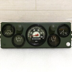 May include: A green dashboard with five gauges. The gauges are labelled with numbers and text. The largest gauge is a speedometer labelled "KM" and reads up to 100. The other gauges are labelled "Топливо", "1/2", "0 2 5", and "40 80 100 110".