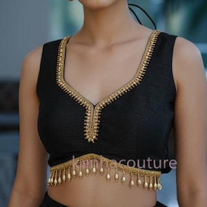 May include: Black sleeveless top and skirt with gold trim and pearl accents. The top has a V-neck and the text "style 3". The brand name "Kanhacouture" is visible at the bottom of the image.