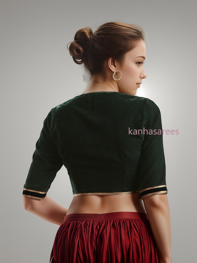 Designer ethnic blouse in green velvet with golden gota lace detailing, perfect for pairing with sarees and lehengas