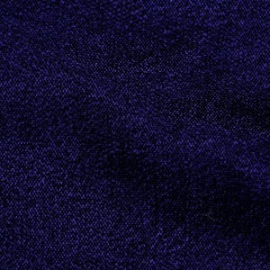 May include: A close-up of a dark blue fabric with a textured weave.