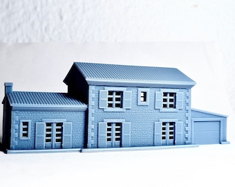 May include: A gray model of a two-story house with a garage. The house has a stone facade with windows and a door. The roof is gray and has a slight slope.