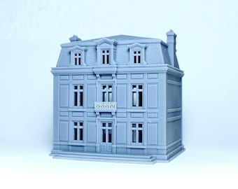 May include: A gray 3D printed model of a three-story house with a mansard roof, a balcony, and multiple windows.