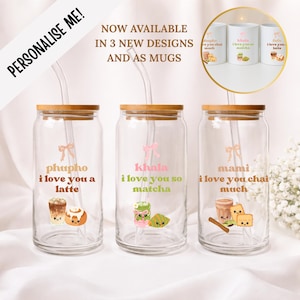 May include: Three clear glass tumblers with bamboo lids and glass straws. Each features a pink bow graphic, custom text, and cute food illustrations: a latte with a cinnamon roll, a matcha drink with a croissant, and chai with crackers.