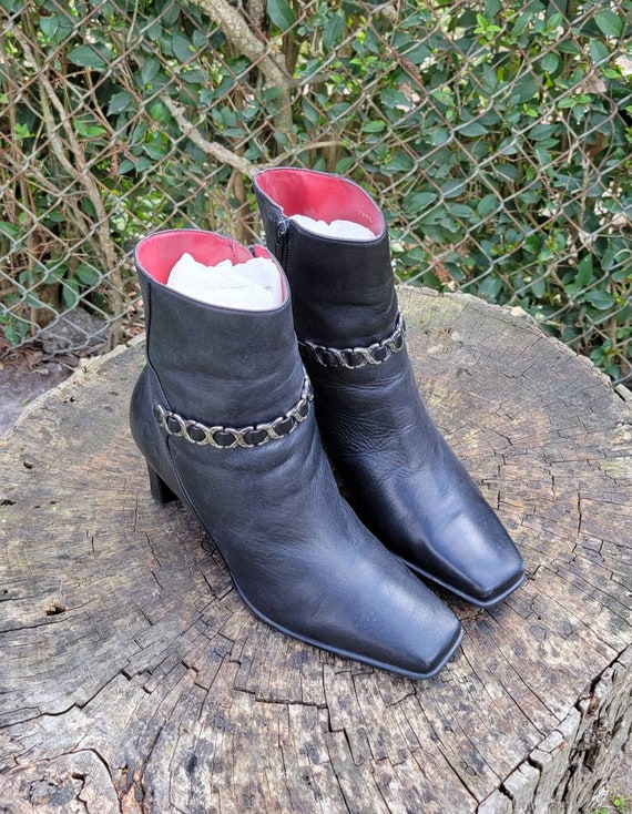 Chanel black leather ankle boots botties cross strap gun metal logo heels