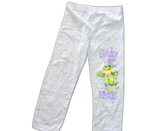 Spodnie dresowe Wojownicze Żółwie Ninja z 1990 roku, TMNT, Shake Your Shell, 10/12, Joggers