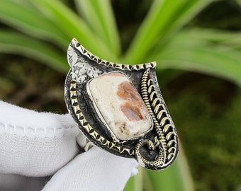 Bid Now: DUE ANELLI IN ORO, ARGENTO, ZAFFIRO, GRANATO E DIAMANTI