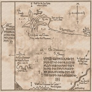 May include: A hand-drawn map of a fictional land with mountains, rivers, and a dragon. The map is labeled with names like "The Lonely Mountain", "The Desolation of Smaug", and "The Iron Hills".